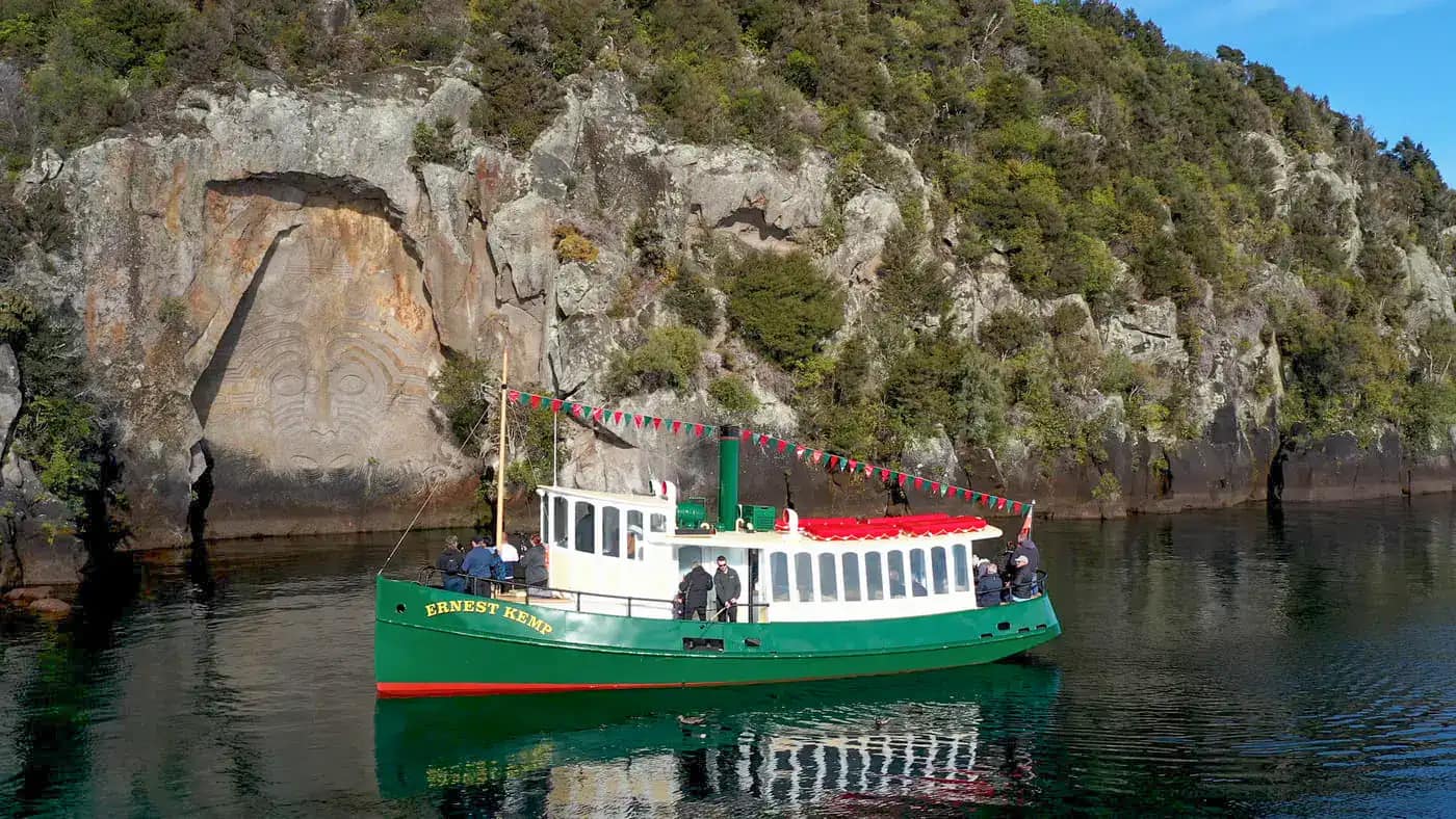 Ernest-kemp-Lake-Taupo-Cruises-16 | Must Do New Zealand | Must Do New Zealand ernest Kemp at the Maori rock carvings on Lake Taupo