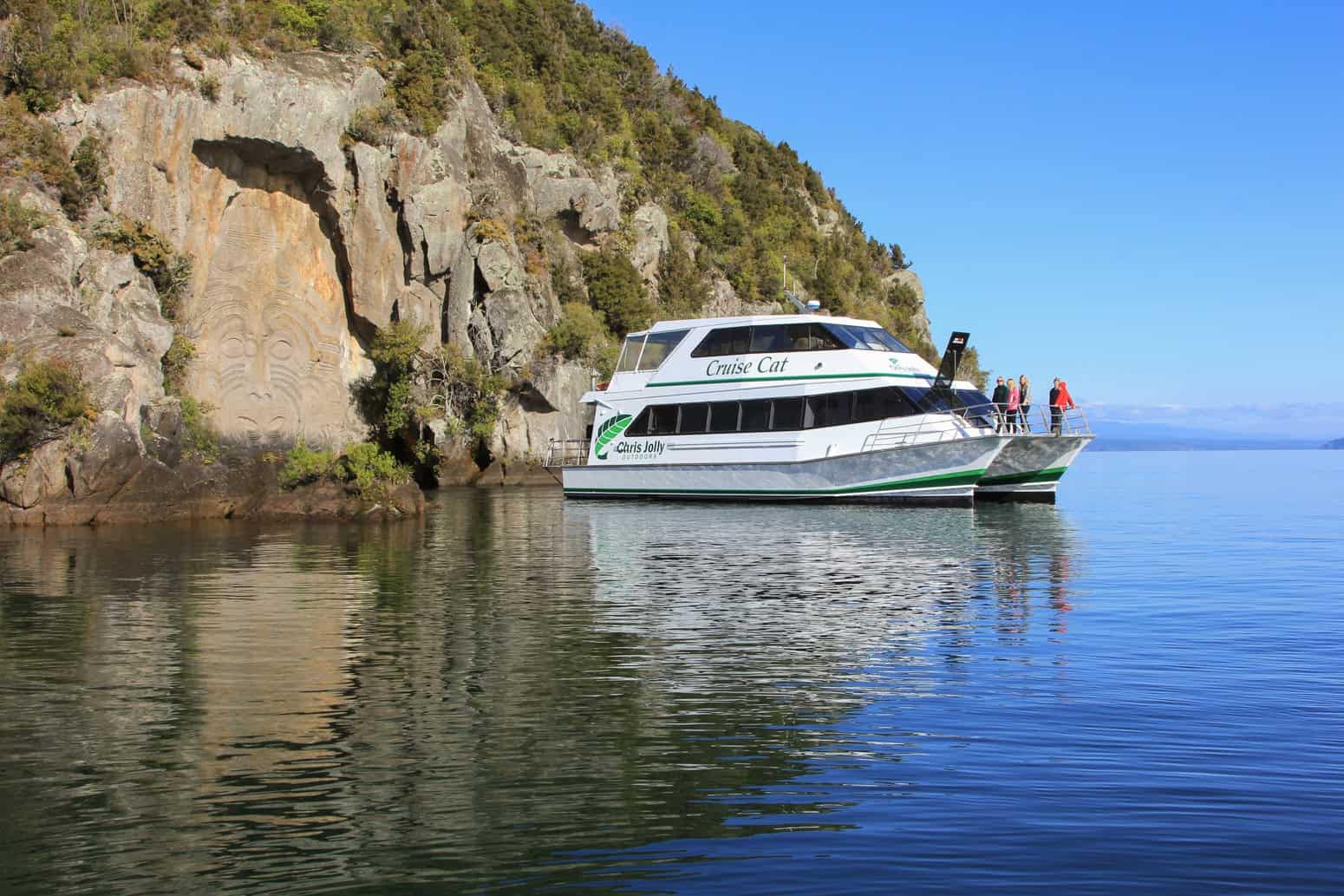 scenic-cruises-on-lake-taupo-chris-jolly-feature-1 | Must Do New Zealand | Must Do New Zealand Maori Rock Carvings at Mine Bay on Lake Taupo scenic cruise