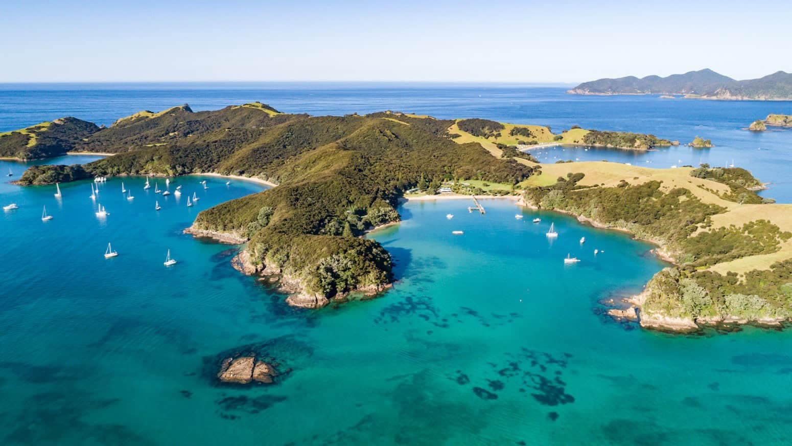 Otehei Bay day trips to Urupukapuka Island Bay of Islands | Must Do New Zealand | Must Do New Zealand aerial image of otehei bay on Urupukapuka Island Bay of Islands